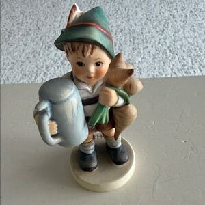 Charming Figurine with Blue and Green Accents